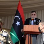 Libya’s UN-backed Prime Minister Fayez Serraj (rear) delivers a speech during the celebration of the Independence Day in Tripoli, Libya, on Dec. 24, 2020. Dec. 24 this year marks the 69th anniversary of the independence of Libya, as Libyans hope to achieve stability and unity of their politically divided country with the elections scheduled for Dec. 24, 2021. (Photo by Hamza Turkia/Xinhua)