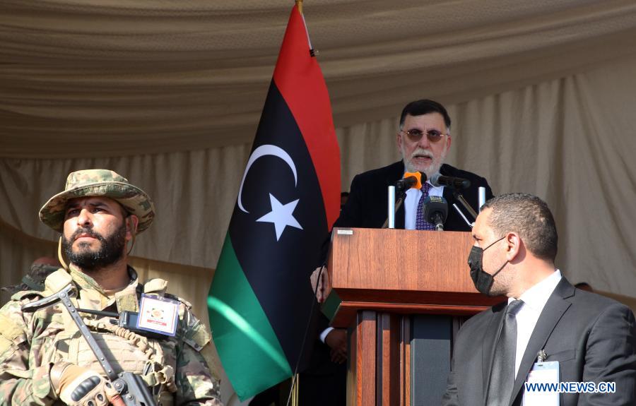 Libya’s UN-backed Prime Minister Fayez Serraj (rear) delivers a speech during the celebration of the Independence Day in Tripoli, Libya, on Dec. 24, 2020. Dec. 24 this year marks the 69th anniversary of the independence of Libya, as Libyans hope to achieve stability and unity of their politically divided country with the elections scheduled for Dec. 24, 2021. (Photo by Hamza Turkia/Xinhua)