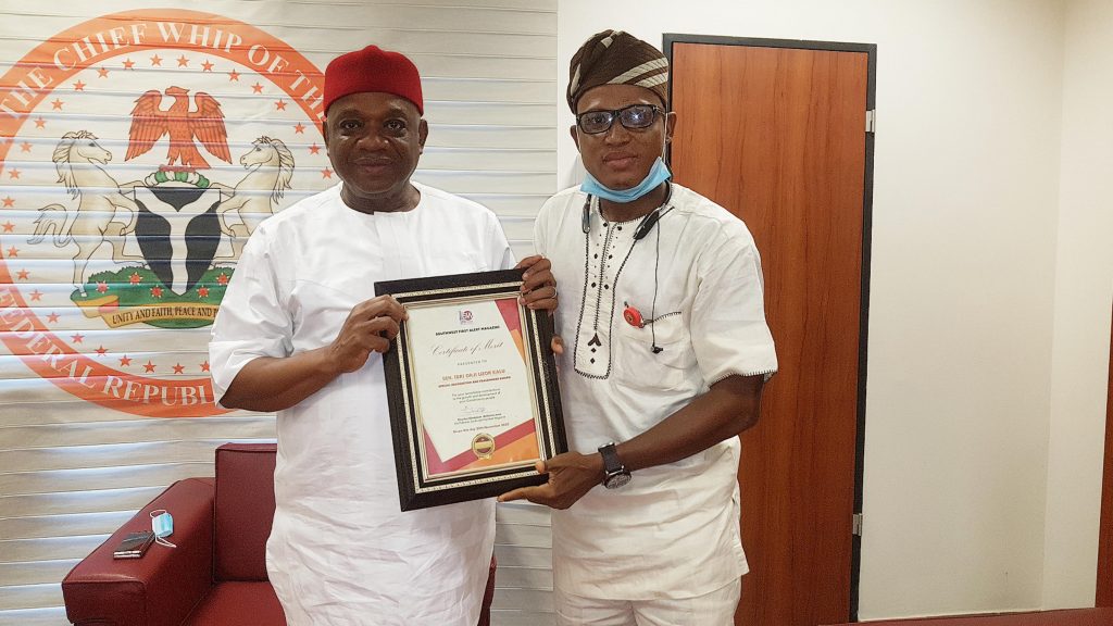 Senator Orjiuzor Kalu (L) receiving the recognition from Southwest First Alert Magazine publisher Mr Charles Oladokun Aridunnu Omo