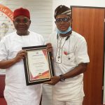 Senator Orjiuzor Kalu (L) receiving the recognition from Southwest First Alert Magazine publisher Mr Charles Oladokun Aridunnu Omo