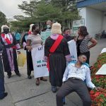 Magistrate Richard Bassey slumped in front of the Governor’s Office while protesting in Calabar, Cross River, on Tuesday, January 2, 2021