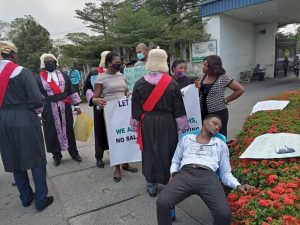 Magistrate Richard Bassey slumped in front of the Governor’s Office while protesting in Calabar, Cross River, on Tuesday, January 2, 2021