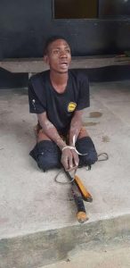 An arrested armed robber being interrogated