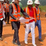 Chairman, GSS Group, Arc. Chukwudi Ezenwa showing the building plan to Commissioner for Lands, Anambra State, Bonaventure Enemal