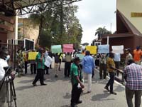 Members of SSANU and NASU University of Lagos branch protesting in front of the main gate