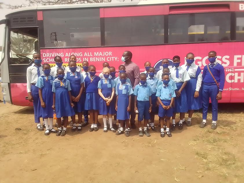 School children queuing beside the bus during the launch of the programme in Benin City