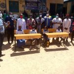 Rotary Club of Jos Central presenting school desks in Jos