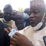 Former Zamfara State Governor Alhaji Abdul’Aziz Yari Abubakar displaying his revalidated APC membership card