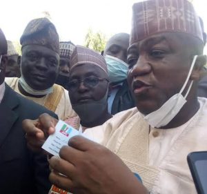 Former Zamfara State Governor Alhaji Abdul’Aziz Yari Abubakar displaying his revalidated APC membership card