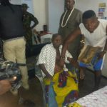 Muri Eyamba (sitting) after his rescue