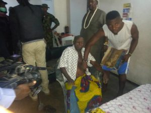 Muri Eyamba (sitting) after his rescue