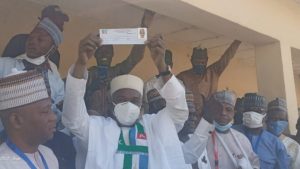 Ambassador Yusuf Tuggar displaying his membership card after his revalidation. Photo credit- Armstrong Bakam