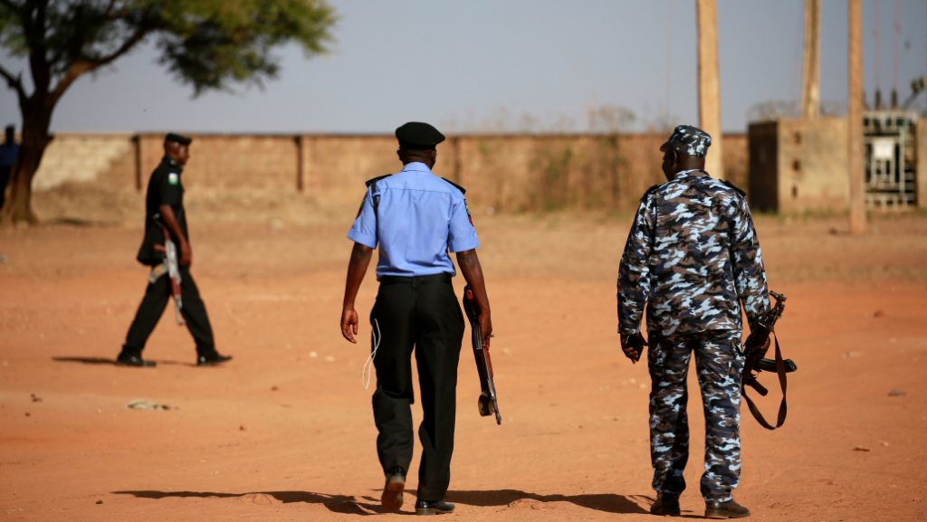 Police patrol inside the Government Science school in Kankara
