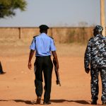 Police patrol inside the Government Science school in Kankara