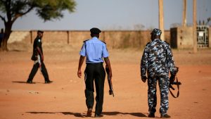 Police patrol inside the Government Science school in Kankara
