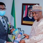 Dr Tunji Asaolu presenting one of the two awards Tambuwal