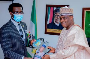 Dr Tunji Asaolu presenting one of the two awards Tambuwal