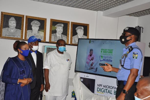 IGP Mohammed Adamu (R)