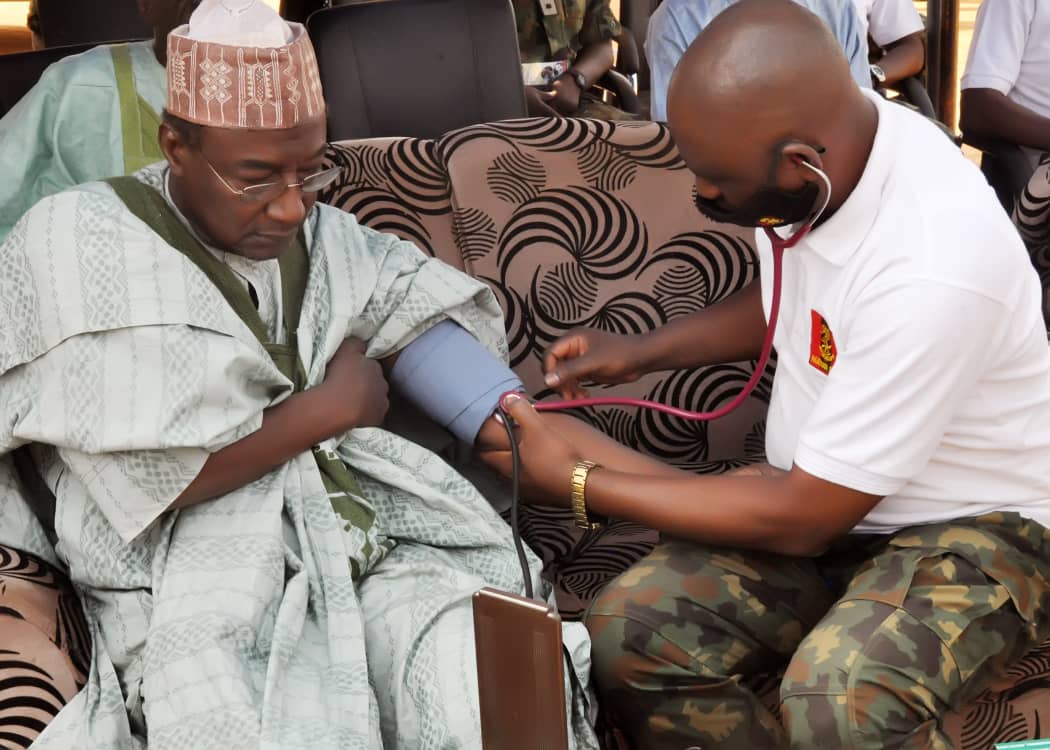 CMD, 44NARH Kaduna, Col A Omogbethai, conducting a blood pressure of the Sarki Badiko, Usman Sani, in Kaduna on Saturday, March 27, 2021