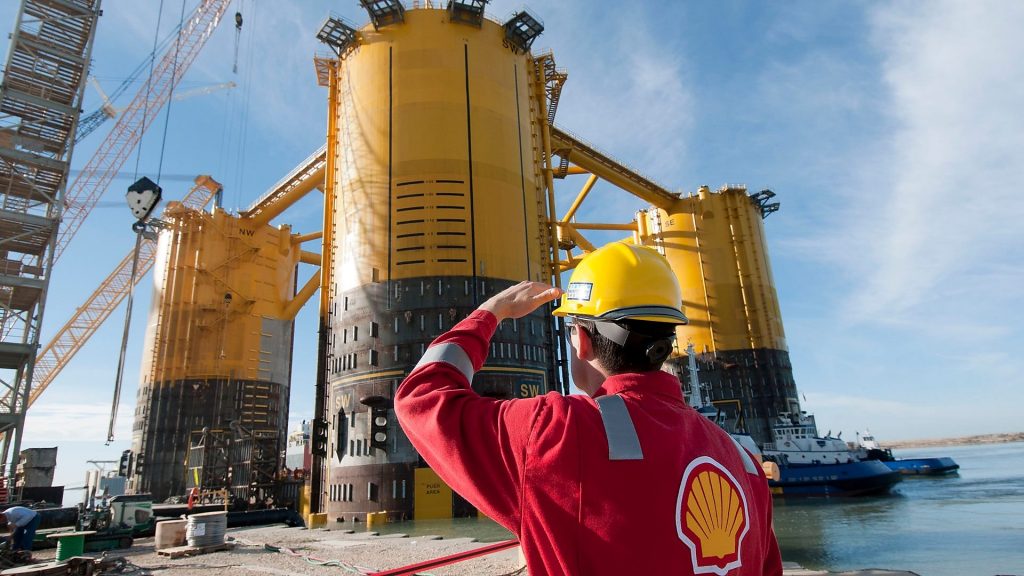engineer-in-red-uniform-with-yellow-hard-hat-by-marsb-platform-construction