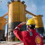 engineer-in-red-uniform-with-yellow-hard-hat-by-marsb-platform-construction