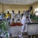 A man votes at a polling station in Kano, Nigeria.