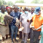 Hon Alphonsus Komsol and NEMA officials inspecting destroyed yam