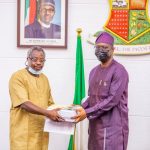 Makinde-receives-the-report-on-LAUTECH-from-Professor-Omole-