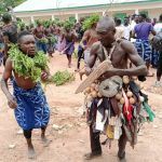 Plateau: Masquerades usher 27th Long Kwo into palace