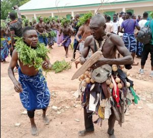 Plateau: Masquerades usher 27th Long Kwo into palace