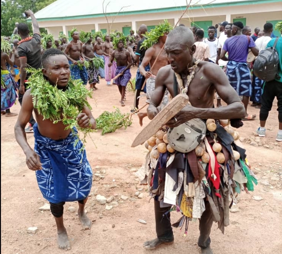 Plateau: Masquerades usher 27th Long Kwo into palace