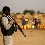 A Nigerien soldier stands guard in a camp of the city of Diffa during the visit of Niger’s Interior Minister Mohamed Bazoum following attacks by Boko Haram fighters in the region of Diffa