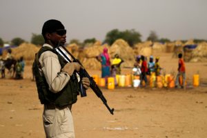 A Nigerien soldier stands guard in a camp of the city of Diffa during the visit of Niger’s Interior Minister Mohamed Bazoum following attacks by Boko Haram fighters in the region of Diffa