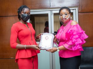 Head, Human Resources (EEDC), Nkiru Chukwuma (L) receiving the award from the Area Manager, ITF Enugu, Uzoamaka Yahaya at EEDC Corporate Headquarters in Enugu.