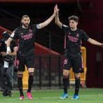 Real Madrid stay in title hunt with win at Granada