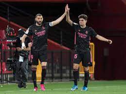 Real Madrid stay in title hunt with win at Granada