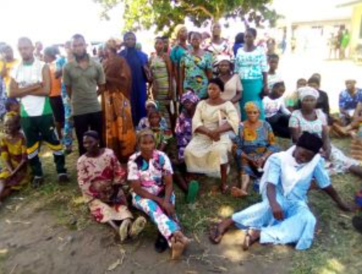 Voters in Ward J, Topo Idale, Badagry voting centres sitting down helplessly to cast their votes