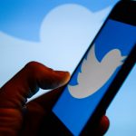 Twitter logo  is seen on an android mobile phone
