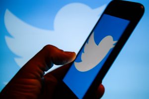 Twitter logo  is seen on an android mobile phone