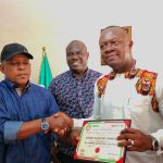 Valentine Ozigbo receiving Certificate of Return from PDP National Chairman Uche Secondus