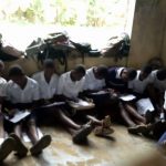 Students on bare floor