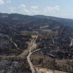 Burnt hillsides are seen following a wildfire near the village of Rovies on the island of Evia, Greece, August 12, 2021. Picture taken with a drone. REUTERS/Alkis Konstantinidis