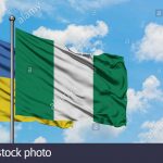 ukraine-and-nigeria-flag-waving-in-the-wind-against-white-cloudy-blue-sky-together-diplomacy-concept-international-relations-2ADPW4M