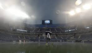 Rain stops play at US Open as storm hits New York