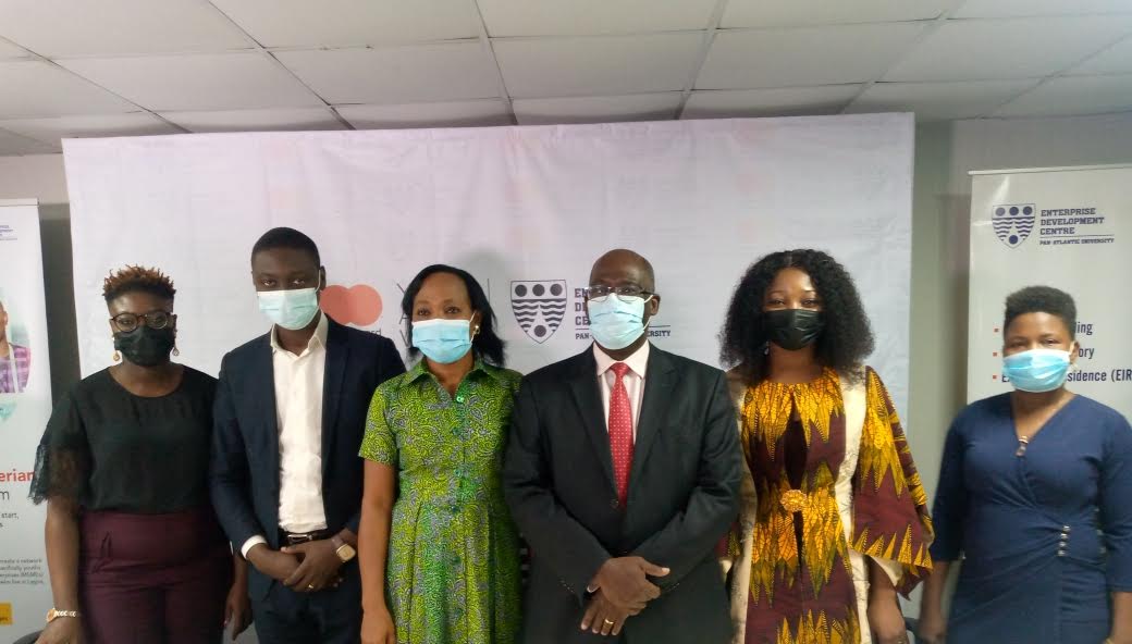 Director, EDC, Peter Bankole (in suit); Country Head (Nigeria) for MasterCard Foundation, Chidinma Lawanson (on his immediate right) and the previous beneficiaries