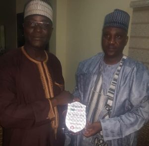 NASS member Hon Abbas (R) receiving an award from the Publisher of Politics Today, Dambatta in Kaduna
