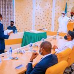 Buhari swears in two INEC commissioners