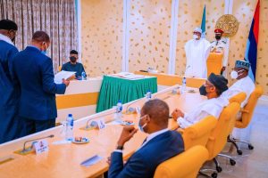 Buhari swears in two INEC commissioners
