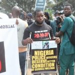 One of last year’s EndSARS protest victims Stephen Asekhame at the anniversary protest in Benin