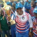 A young Delta State athlete and his coach celebrate victory at the National Youth Games in Ilorin